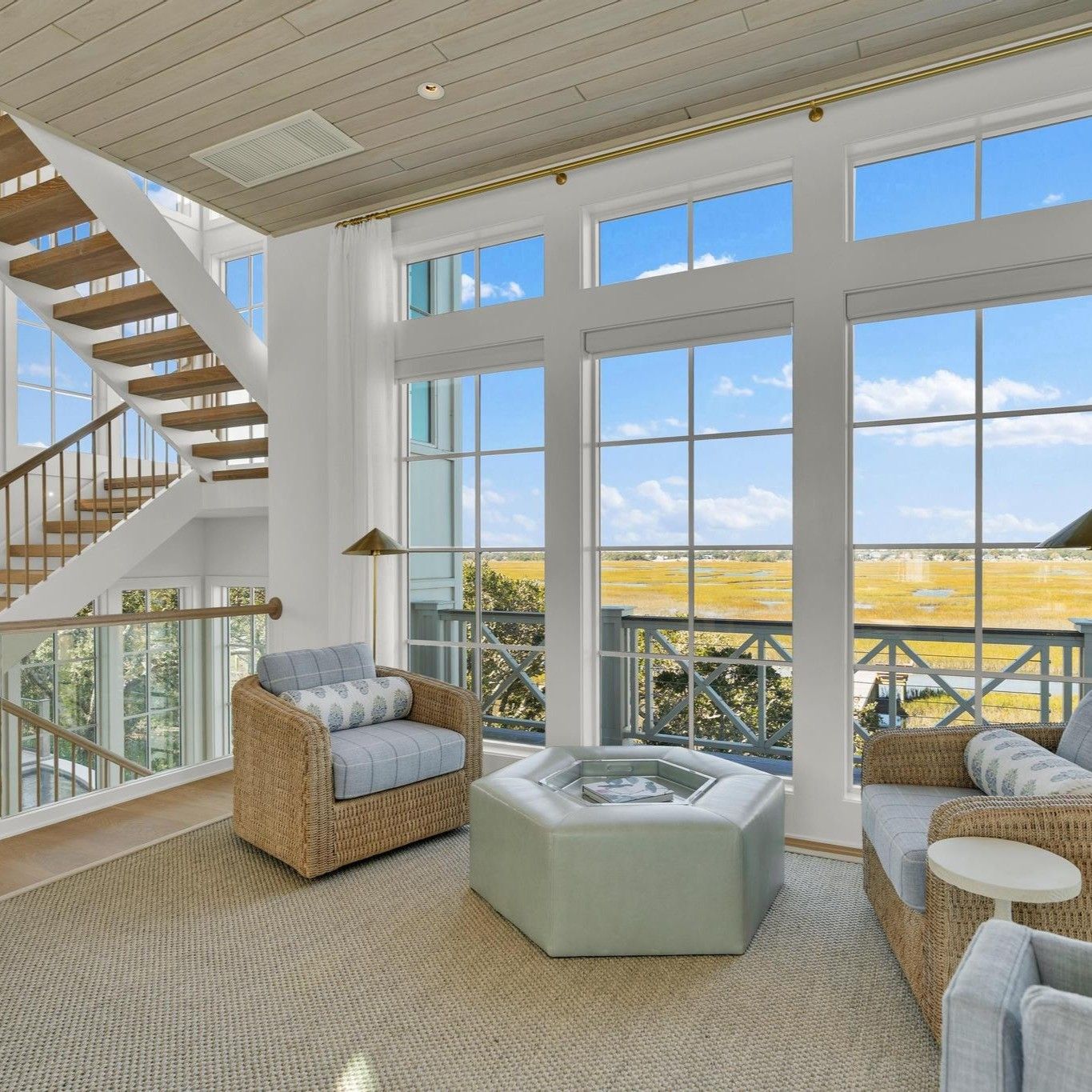 Sunroom with full-height windows overlooking the marsh