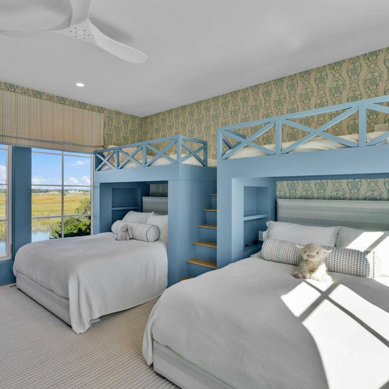 Blue guest suite with broad marsh views