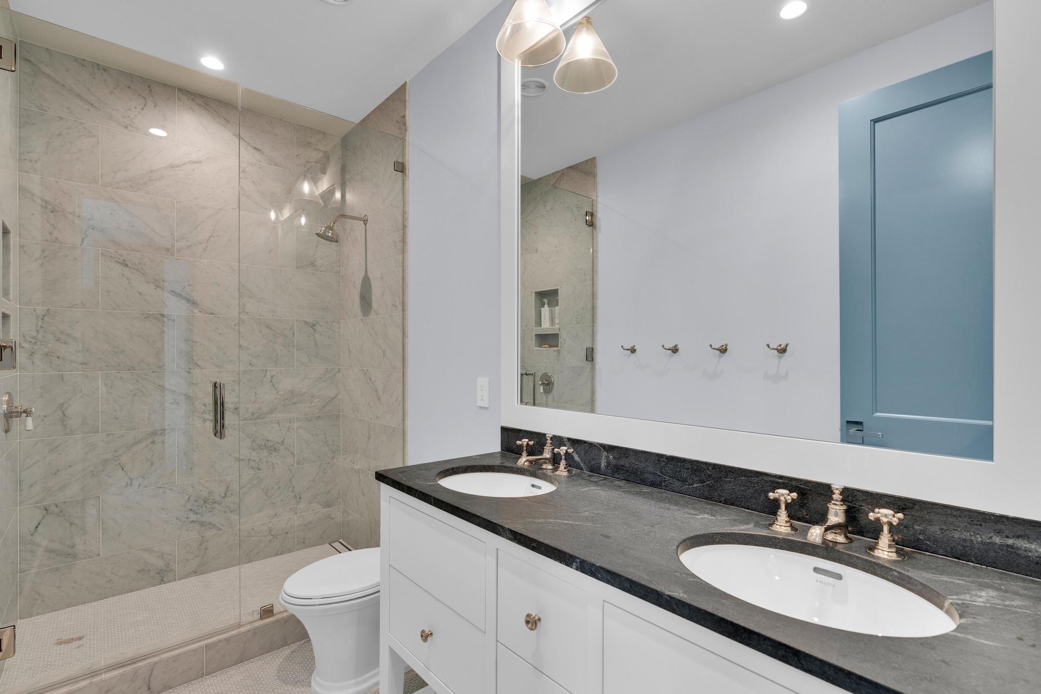 Guest bunk bath with a marble double vanity