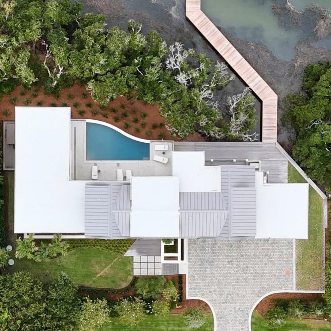 Aerial view of the pool terrace and landscaped grounds