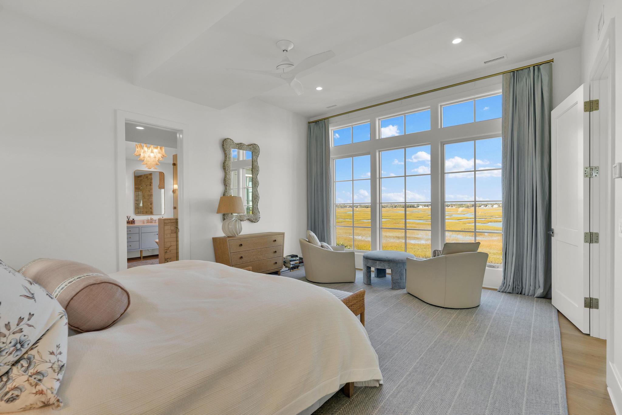 Primary bedroom with a sitting area facing the marsh