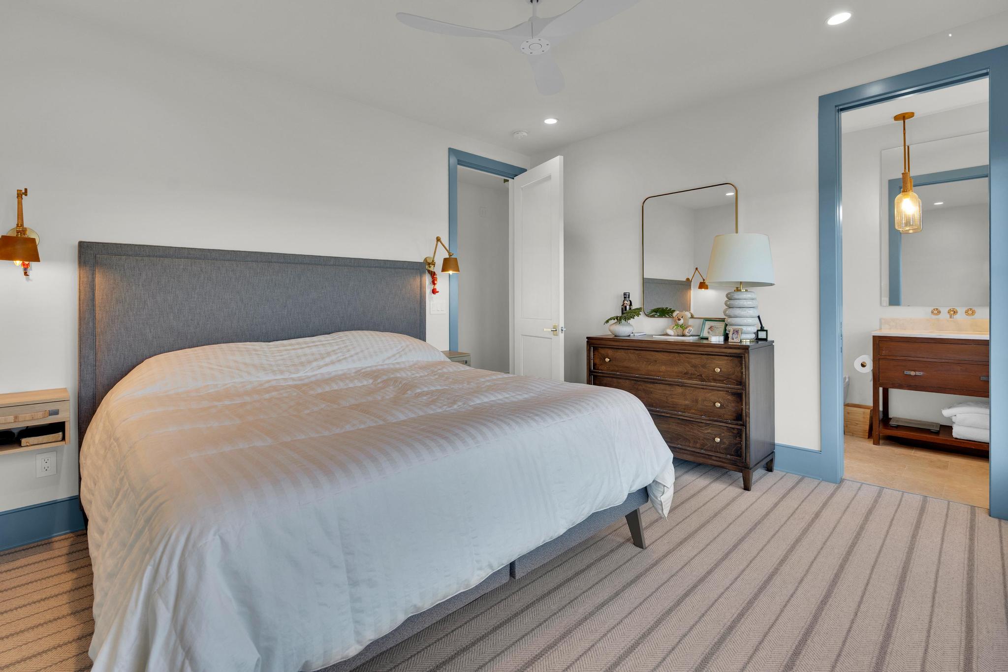 Guest bedroom with blue trim and marsh views